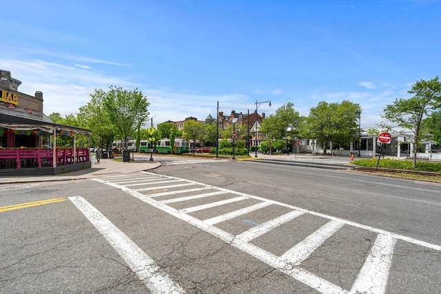 149 Winthrop Rd Unit 5, Brookline, MA 02445 - view of asphalt street featuring traffic signs, street lighting, sidewalks, and curbs