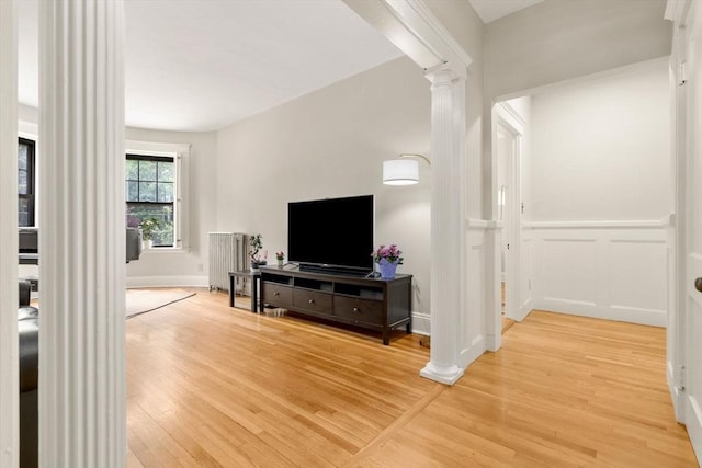 149 Winthrop Rd Unit 5, Brookline, MA 02445 - living area with decorative columns, light wood-type flooring, and baseboards