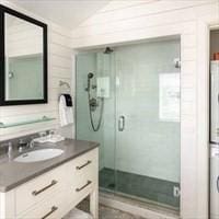bathroom featuring vanity and a shower stall
