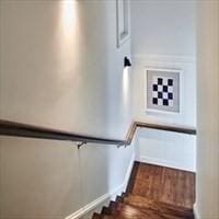 stairway featuring baseboards