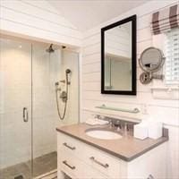 full bathroom featuring vanity and a shower stall