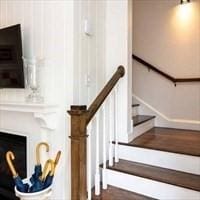 stairway featuring wood finished floors
