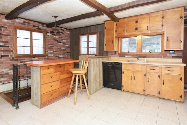 kitchen with beam ceiling, sink, black dishwasher, and brick wall