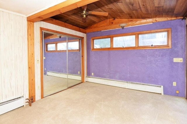 interior space featuring ceiling fan, vaulted ceiling, and a baseboard heating unit