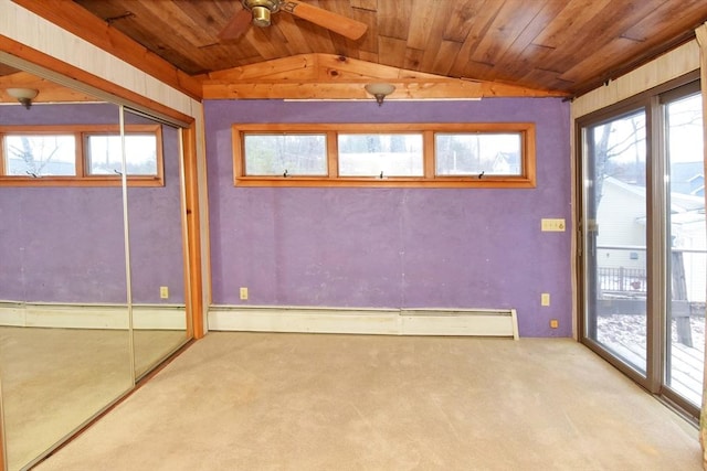 spare room featuring light carpet, ceiling fan, wood ceiling, and lofted ceiling