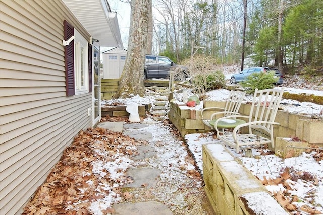 view of yard layered in snow