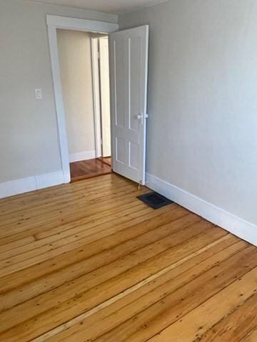 spare room featuring light hardwood / wood-style floors