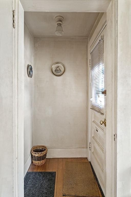 doorway to outside with wood-type flooring