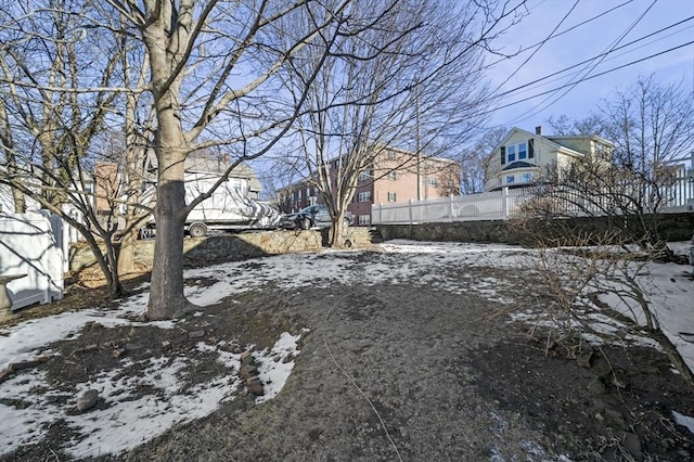 view of yard layered in snow