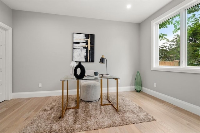 home office with recessed lighting, baseboards, and wood finished floors