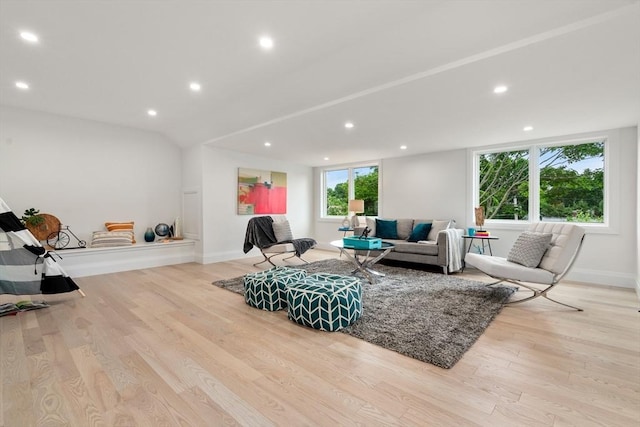 living room featuring recessed lighting, baseboards, and wood finished floors