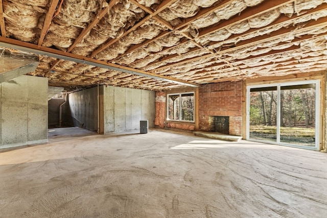 miscellaneous room with a brick fireplace