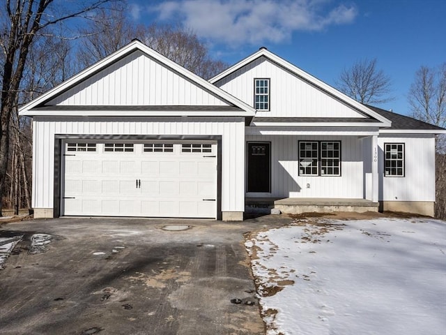 view of front facade featuring a porch and a garage