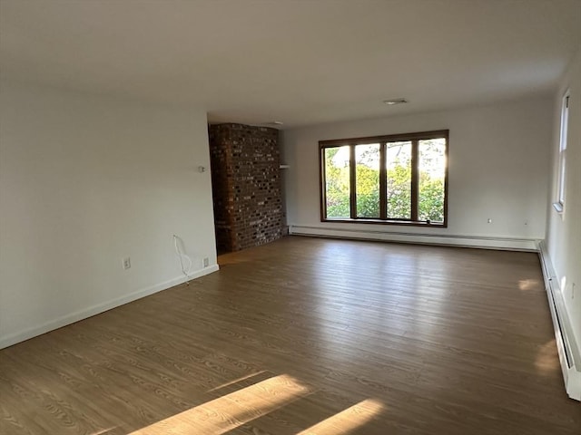21 Friends Ln, Dennis, MA 02660 - spare room featuring baseboard heating and wood finished floors
