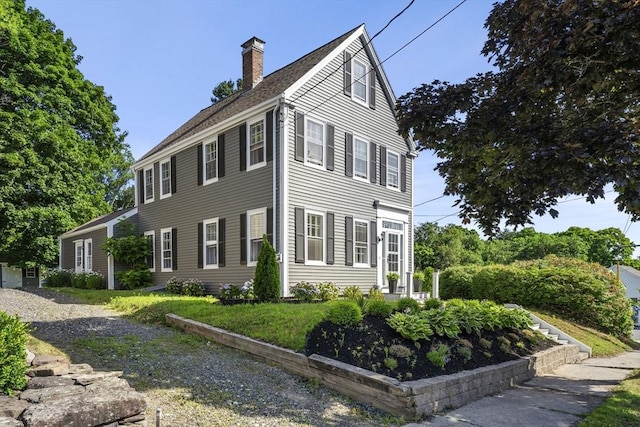 view of home's exterior with a lawn