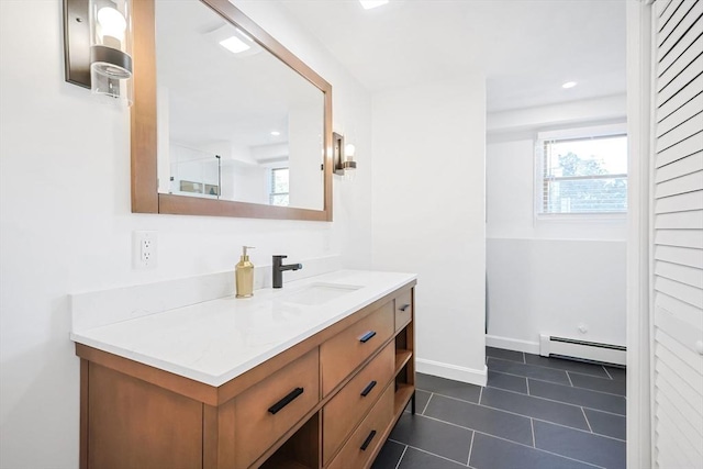 bathroom featuring recessed lighting, a baseboard heating unit, vanity, baseboards, and tile patterned floors