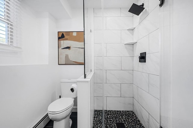 full bath with a baseboard radiator, a shower stall, and toilet