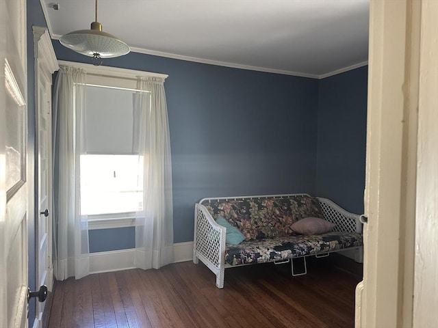 sitting room with crown molding and dark hardwood / wood-style floors