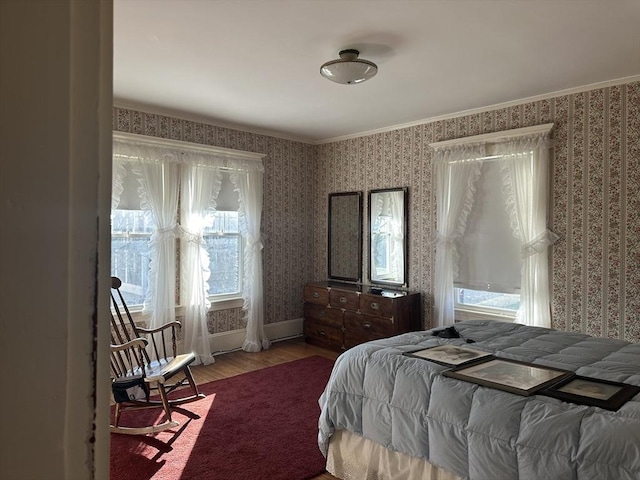 bedroom with crown molding and wood-type flooring