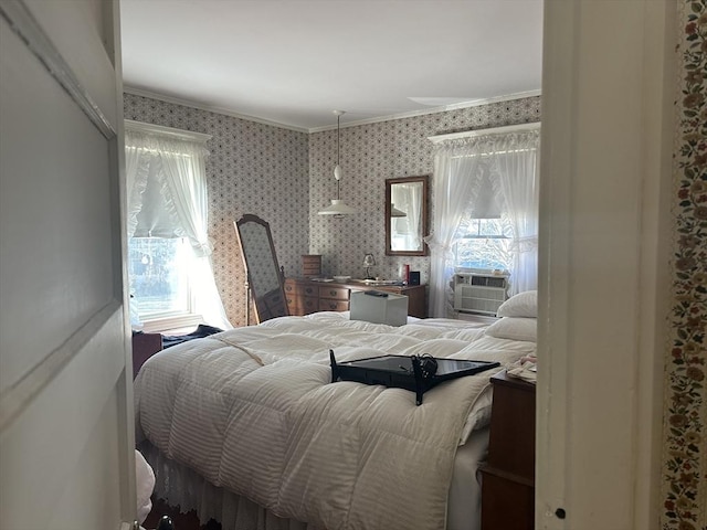 bedroom featuring multiple windows, crown molding, and cooling unit