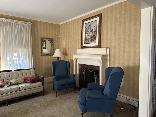 sitting room featuring ornamental molding and carpet flooring