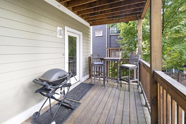 wooden deck with grilling area