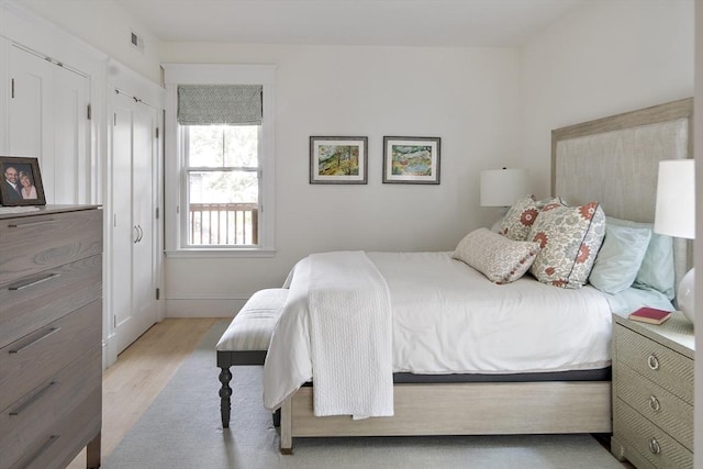 bedroom with light hardwood / wood-style floors