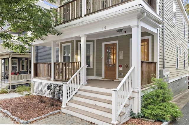 doorway to property featuring covered porch