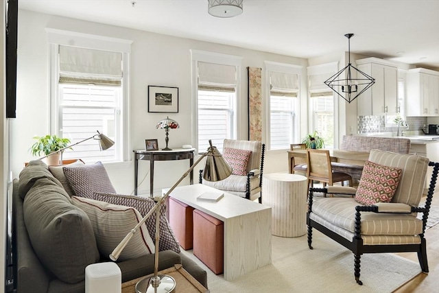 interior space featuring sink and a chandelier