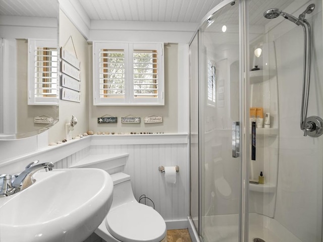 5 Adams St, Littleton, MA 01460 - bathroom with a sink, a shower stall, toilet, wooden ceiling, and wainscoting