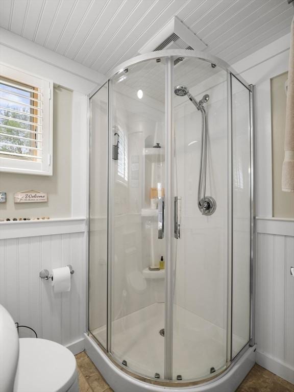 5 Adams St, Littleton, MA 01460 - bathroom featuring toilet, a stall shower, a wainscoted wall, and a decorative wall