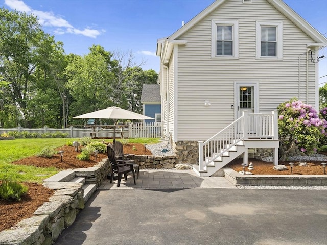 5 Adams St, Littleton, MA 01460 - back of property with a patio area