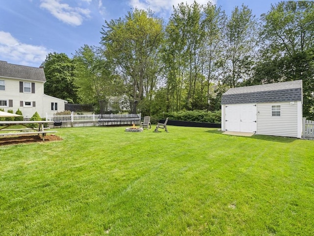 5 Adams St, Littleton, MA 01460 - view of yard featuring an outdoor fire pit and a trampoline