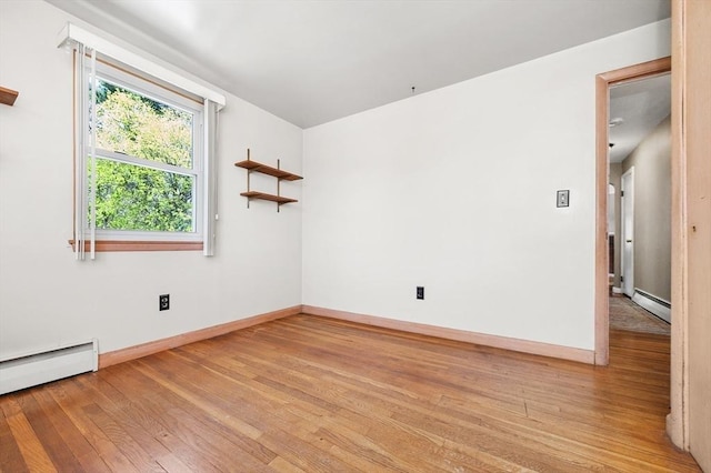 unfurnished room featuring baseboards, a baseboard heating unit, a baseboard radiator, and light wood-style floors
