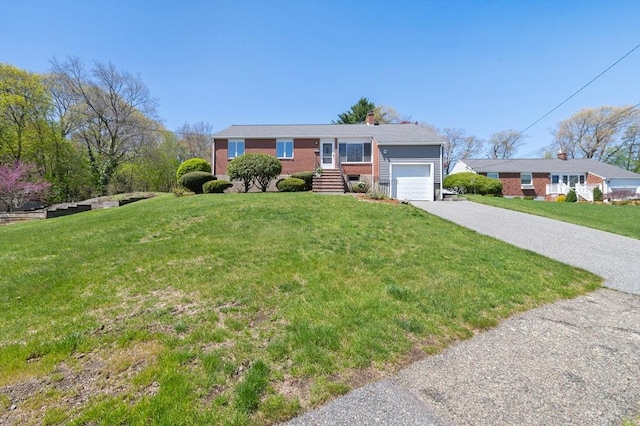 view of front of property featuring a garage, a chimney, a front lawn, and aphalt driveway