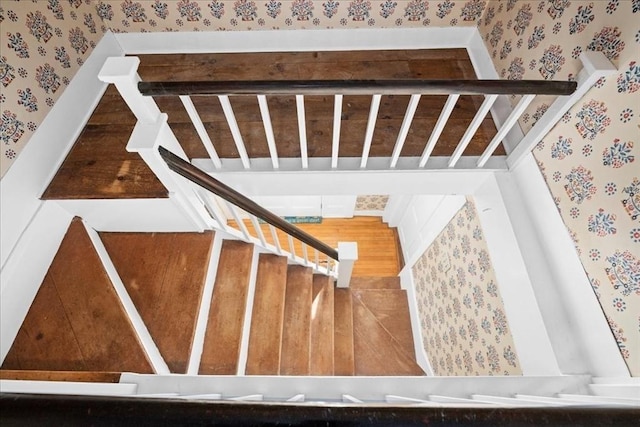 stairway with wallpapered walls