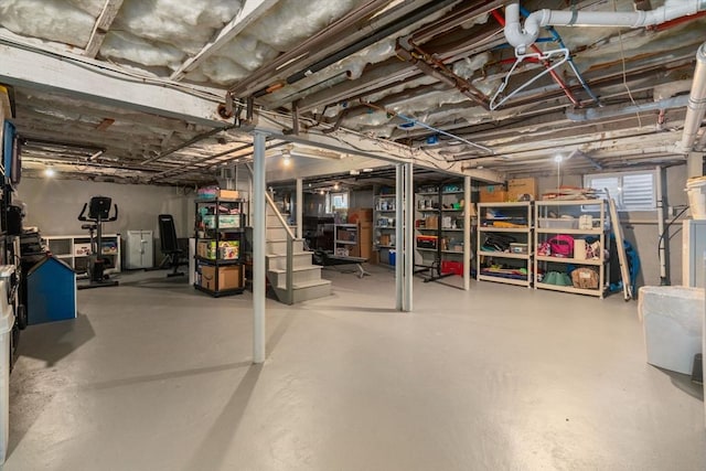 unfinished basement featuring stairway