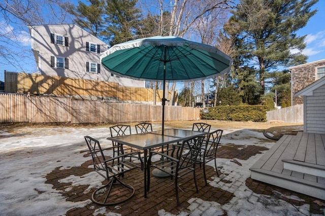 view of patio / terrace with outdoor dining area and fence