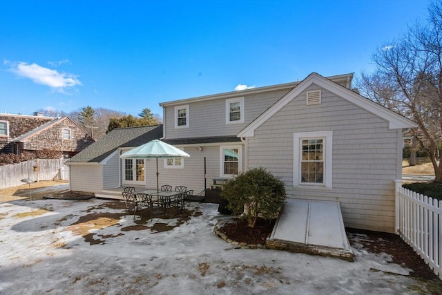 rear view of property with a fenced backyard