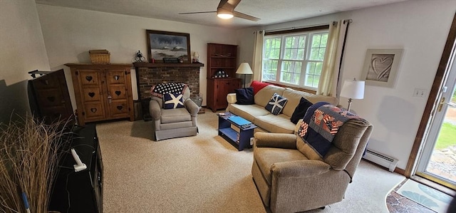 3 Kenneth St, Sandwich, MA 02537 - living area with a baseboard radiator, light colored carpet, ceiling fan, and a fireplace