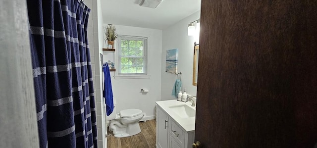 3 Kenneth St, Sandwich, MA 02537 - bathroom featuring wood finished floors, vanity, toilet, curtained shower, and baseboards