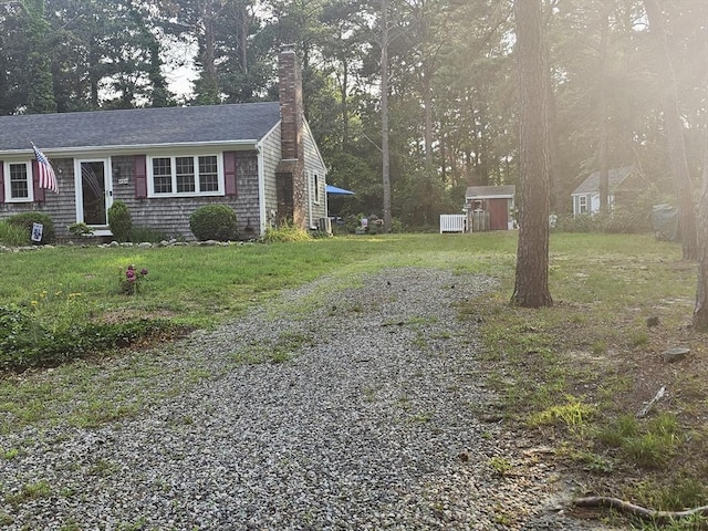 3 Kenneth St, Sandwich, MA 02537 - view of home's exterior featuring a chimney and a yard