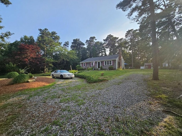 3 Kenneth St, Sandwich, MA 02537 - single story home with a chimney, driveway, and a front yard