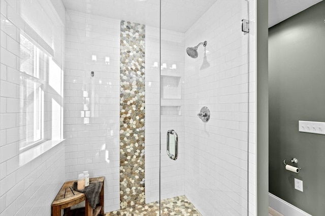 bathroom with a shower stall