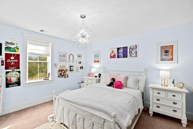 bedroom with an inviting chandelier, baseboards, visible vents, and dark colored carpet