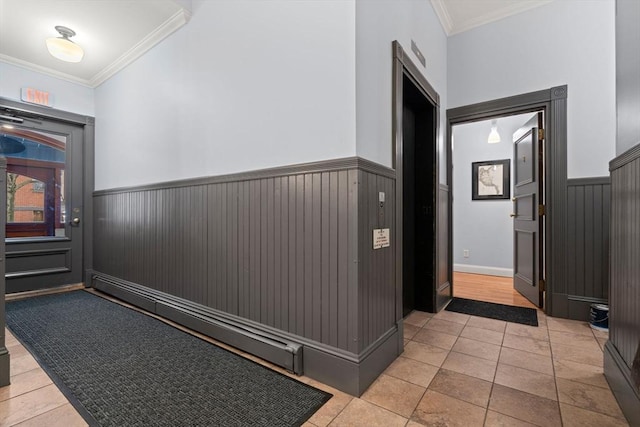 hallway featuring light tile patterned floors and ornamental molding