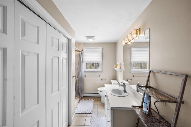 239 Upper County Rd, Dennis, MA 02660 - bathroom featuring baseboard heating, toilet, tile patterned floors, vanity, and curtained shower