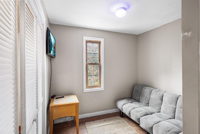239 Upper County Rd, Dennis, MA 02660 - sitting room with wood finished floors and baseboards