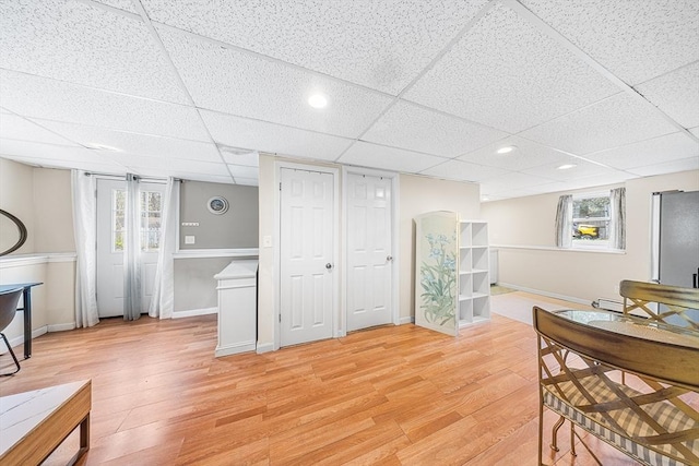 239 Upper County Rd, Dennis, MA 02660 - dining room featuring light wood-style floors, baseboards, a drop ceiling, baseboard heating, and recessed lighting