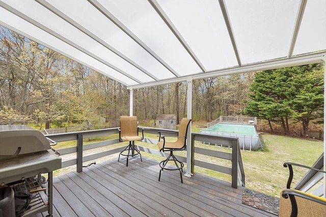239 Upper County Rd, Dennis, MA 02660 - deck with an outdoor pool, a yard, a grill, and view of wooded area